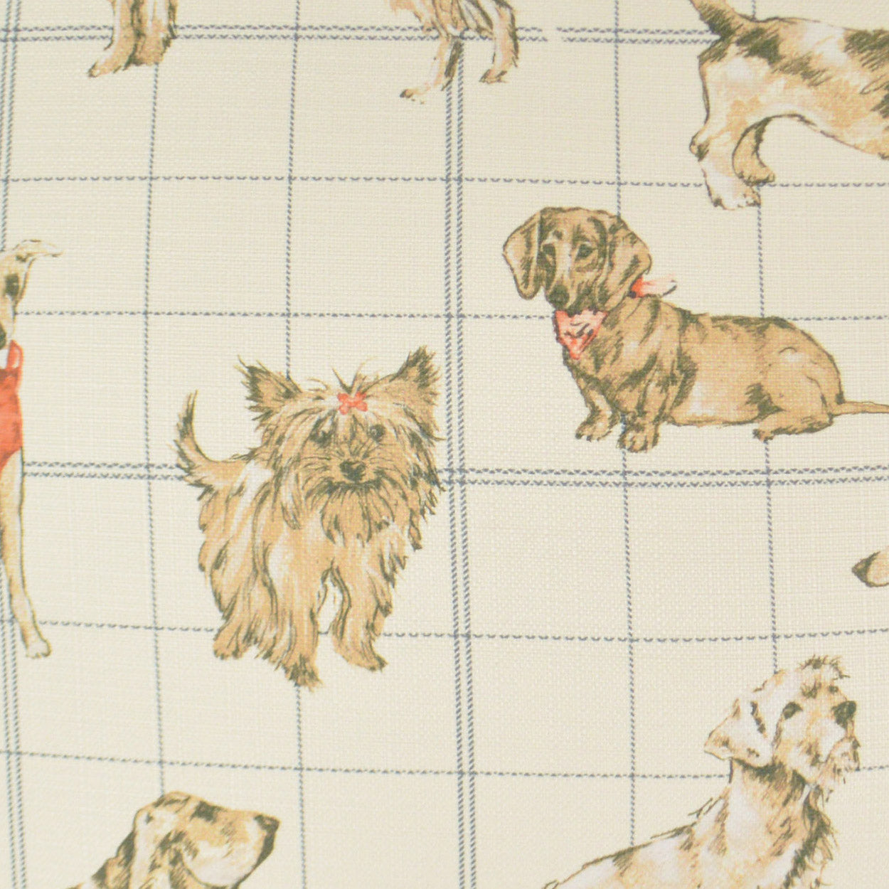 Cream dog-print fabric with brown/beige illustrated dogs on a blue grid pattern; whimsical pet textile.