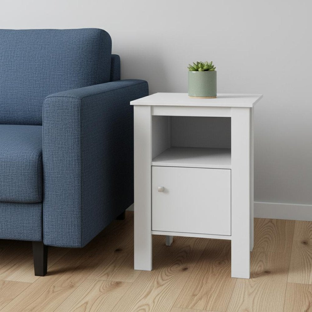 White wooden end table with an open shelf beside a blue upholstered sofa; succulent in a pot on top.