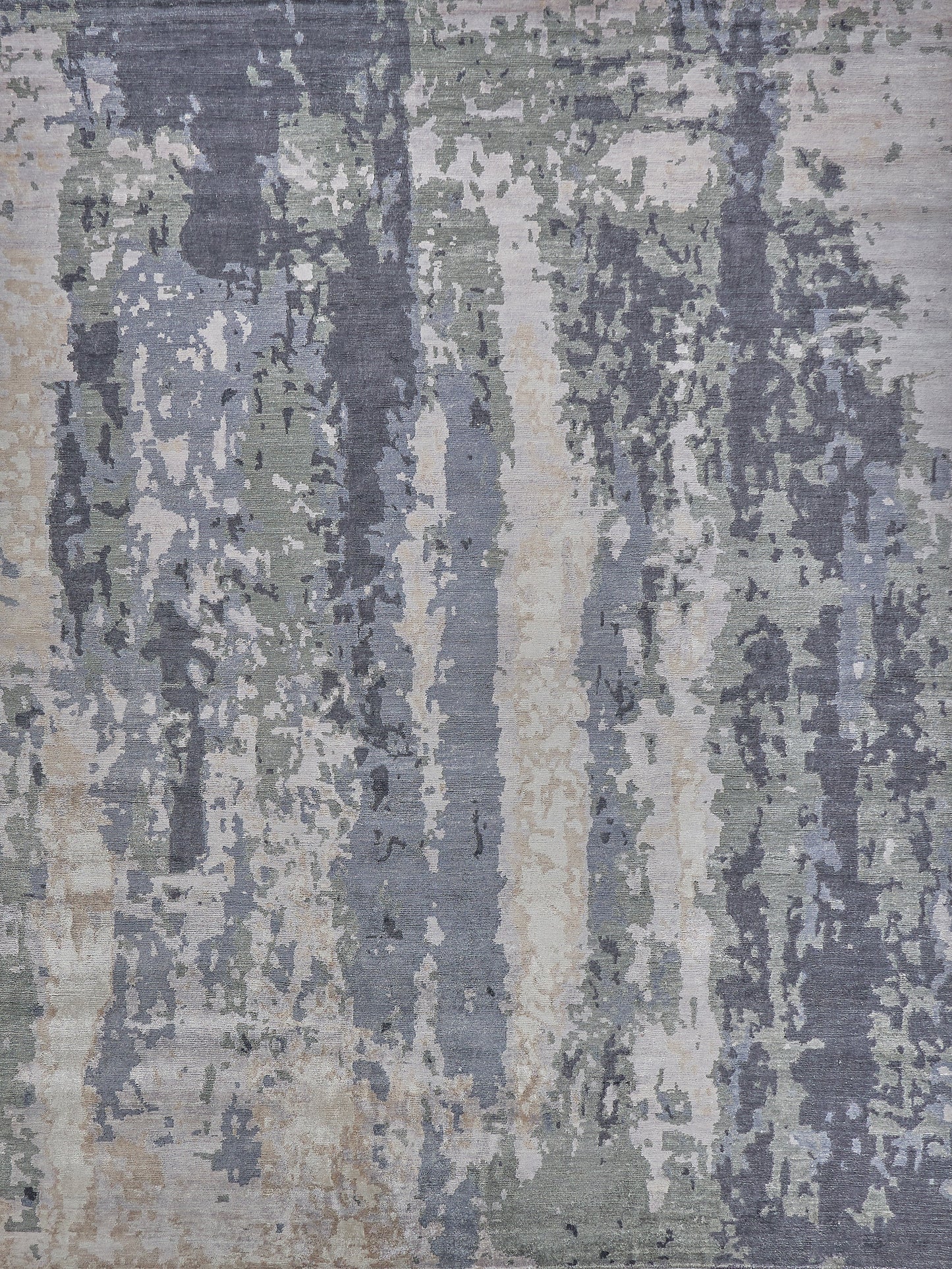 Abstract patterned area rug featuring shades of gray, green, and beige, with a textured surface ideal for modern decor.
