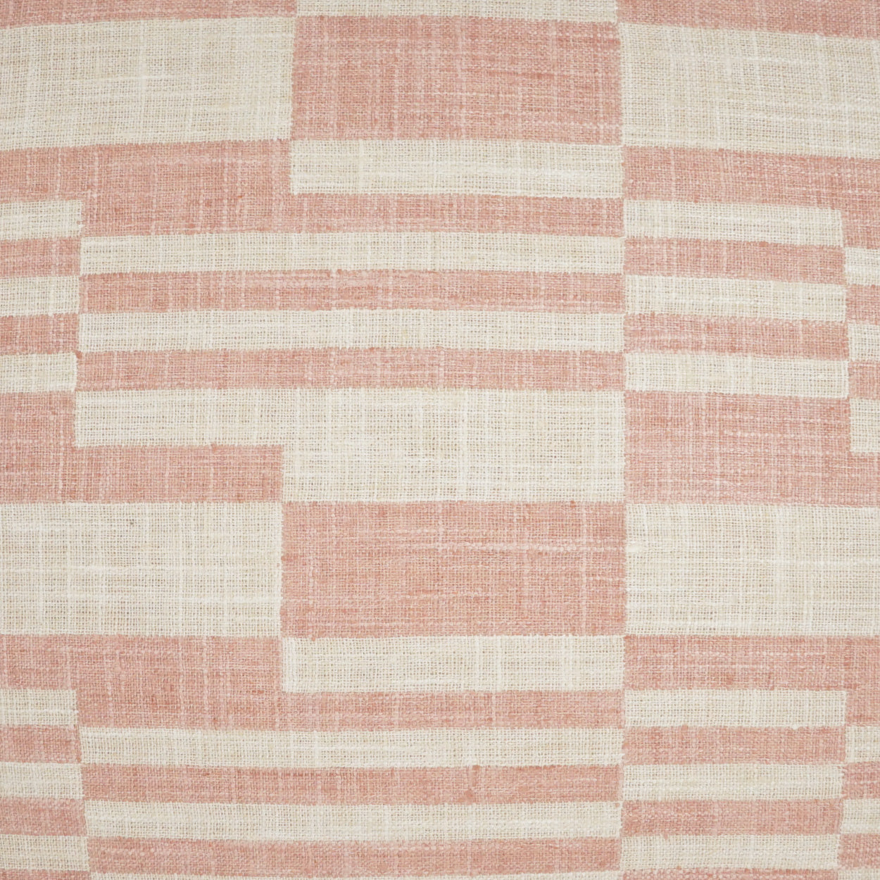 Pink and cream woven fabric with a geometric brick-like stripe pattern; linen-textured, ideal for upholstery or cushions.