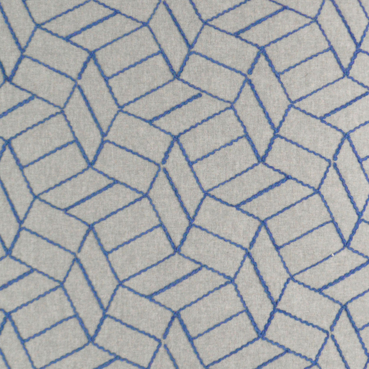Gray fabric rug with blue outlined 3D cube geometric pattern.