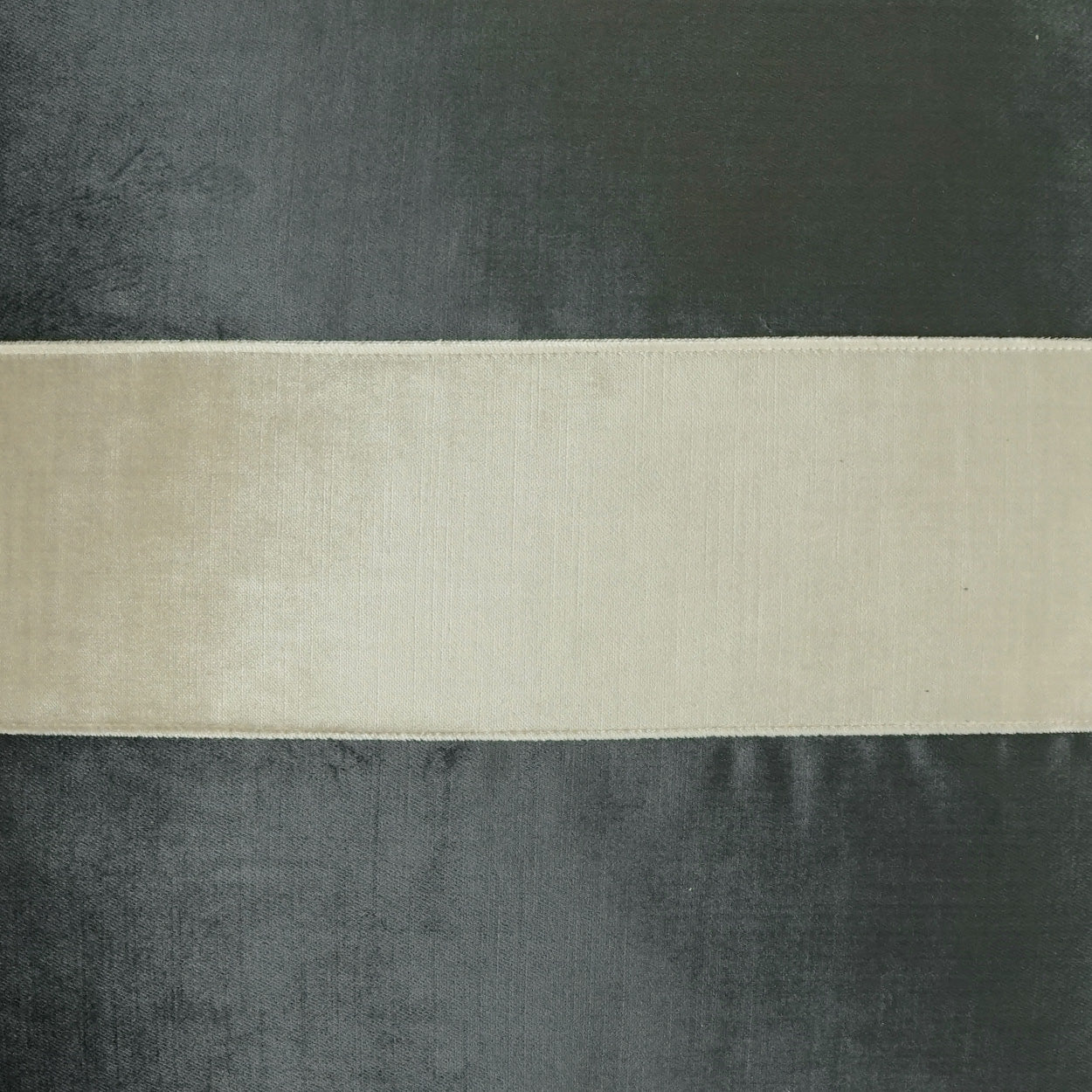 Dark charcoal-gray fabric with a wide cream middle stripe, textured textile swatch.