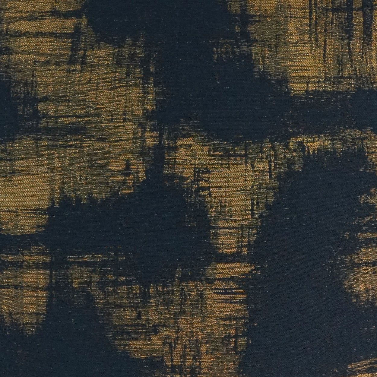 Abstract navy blue and gold brushstroke fabric, textured woven pattern for upholstery or drapes.