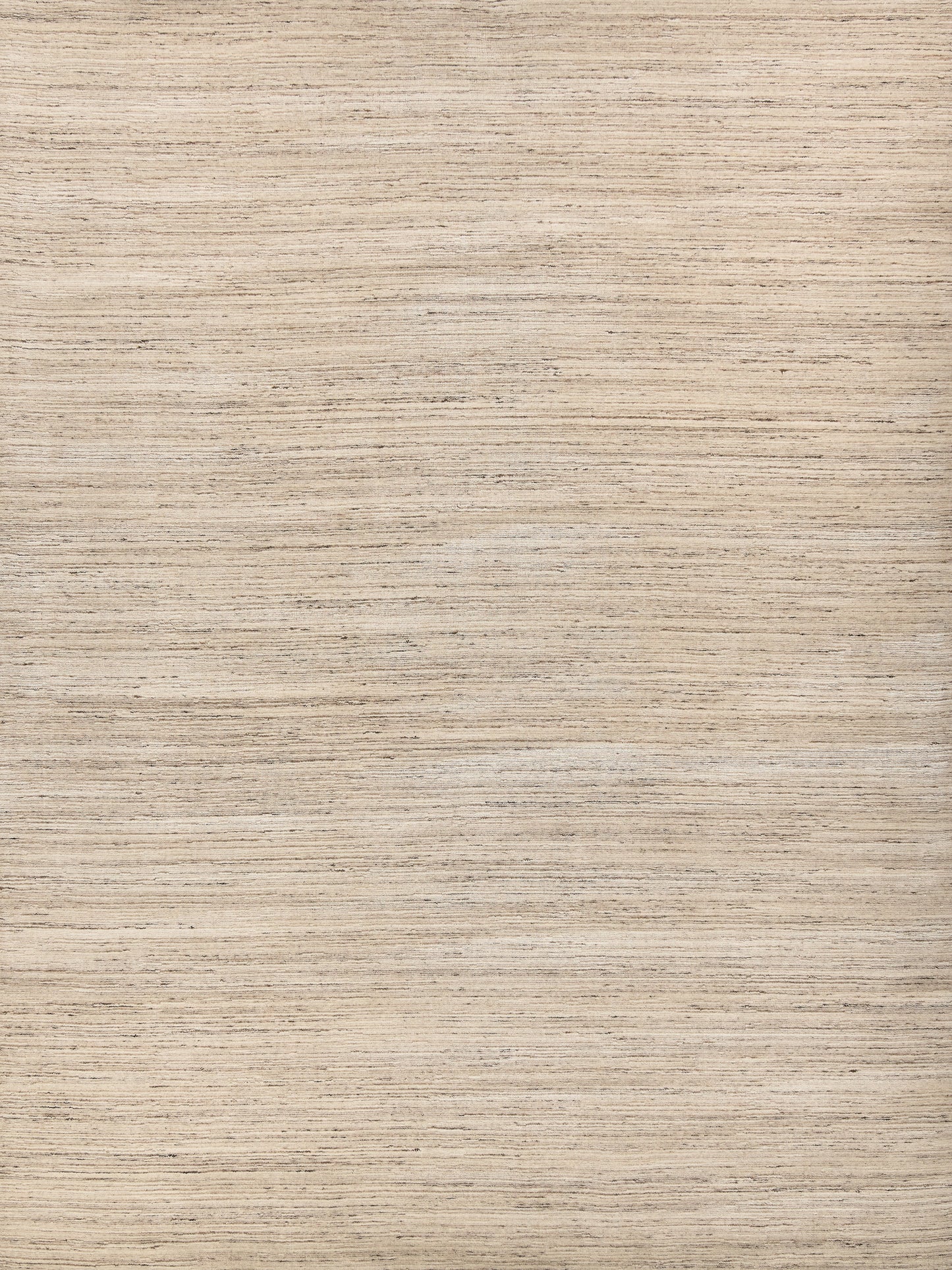 Beige & taupe woven rug with a subtle pattern; soft hand loomed texture.