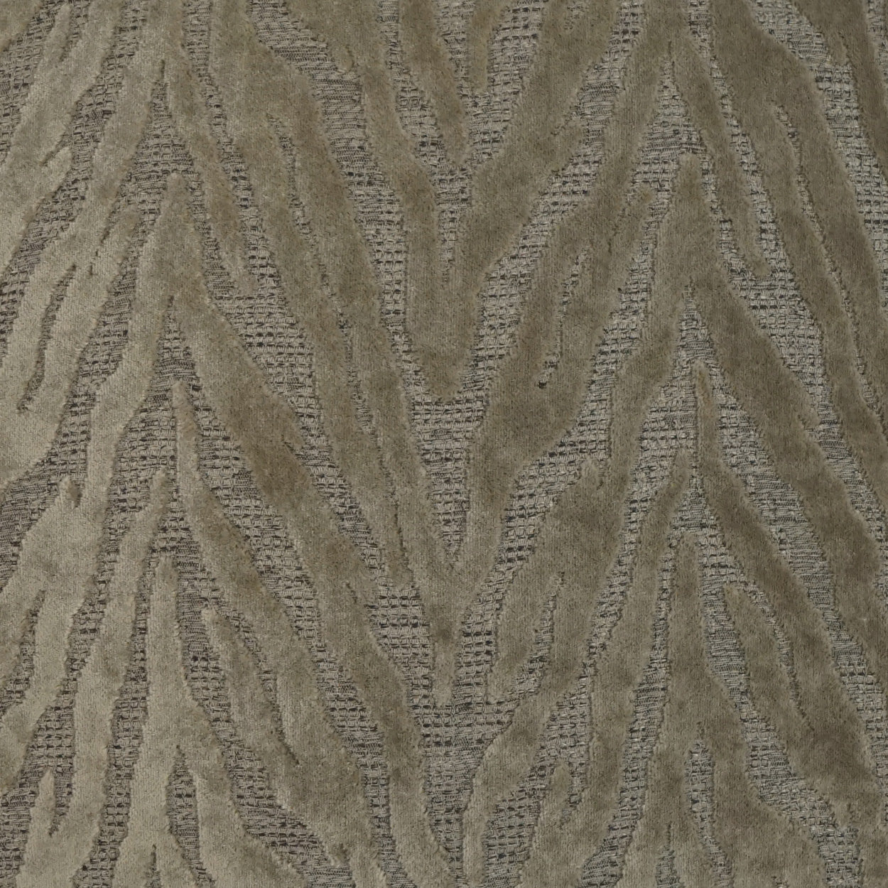 Beige-taupe fabric with raised velvety wavy leaf pattern; versatile upholstery or drapery textile.