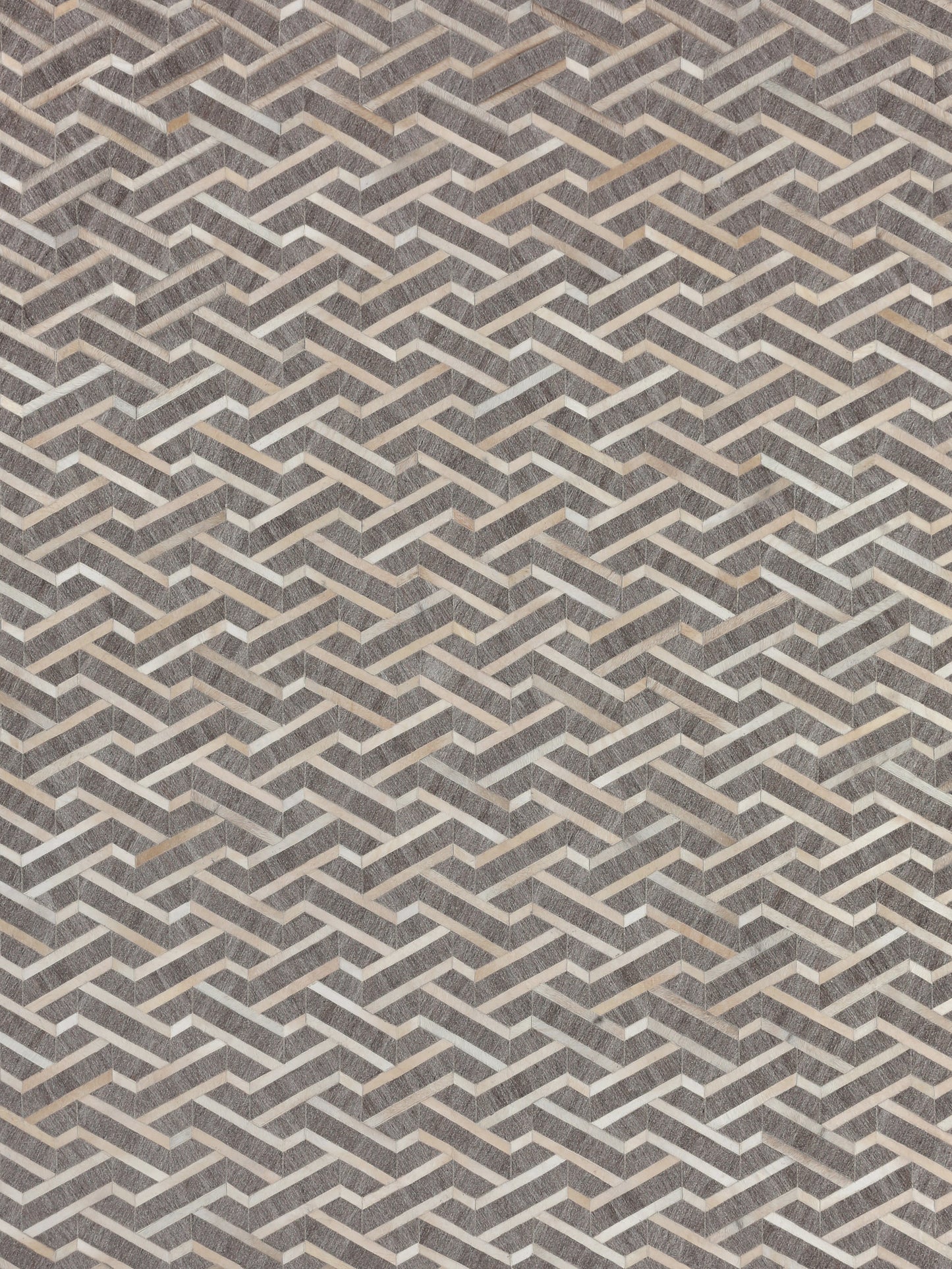 Geometric pattern in beige and gray tones, featuring zigzag shapes with layered textures, ideal for flooring or wall décor.