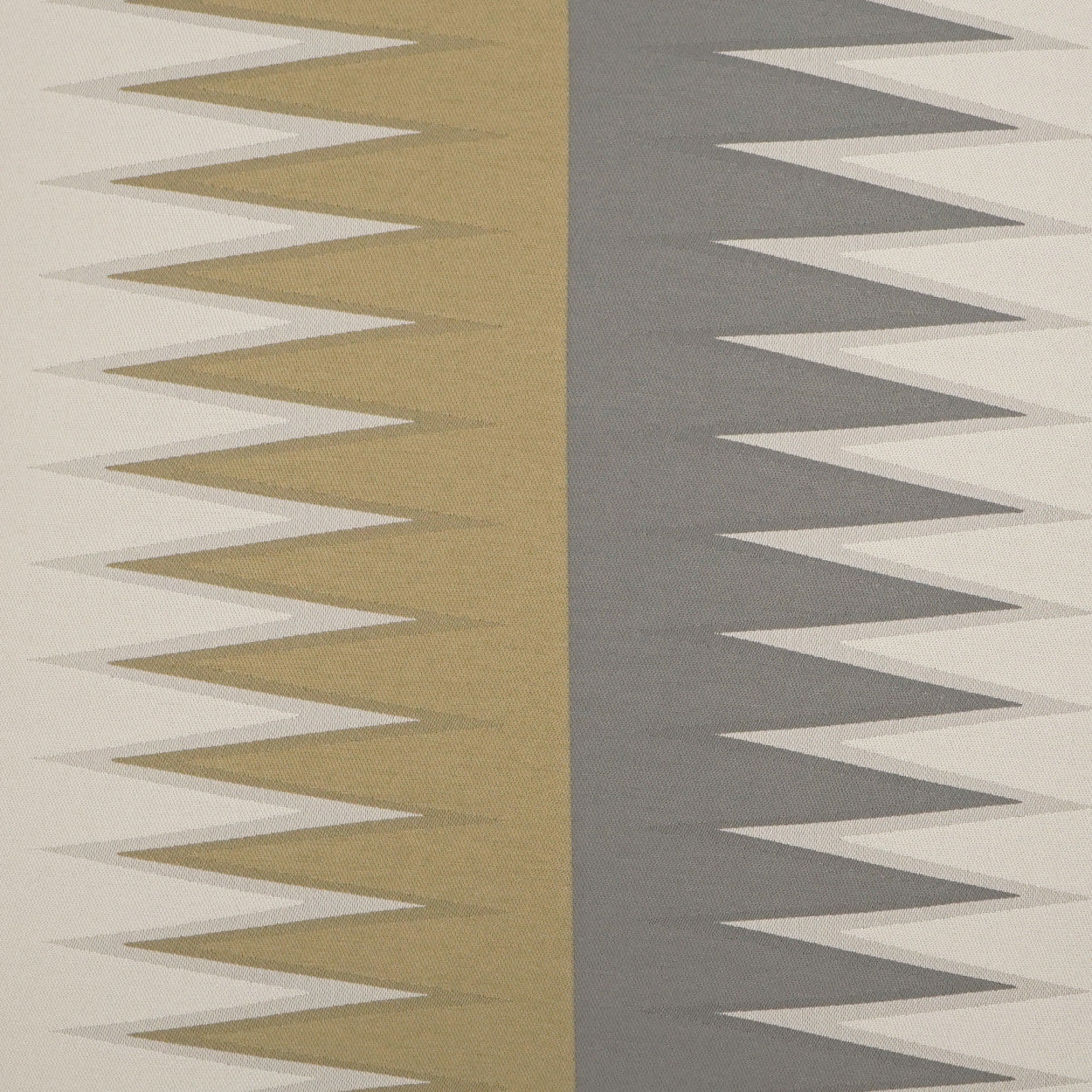 Two-tone zigzag chevron fabric: gold left panel and gray right panel on cream/beige backdrop.