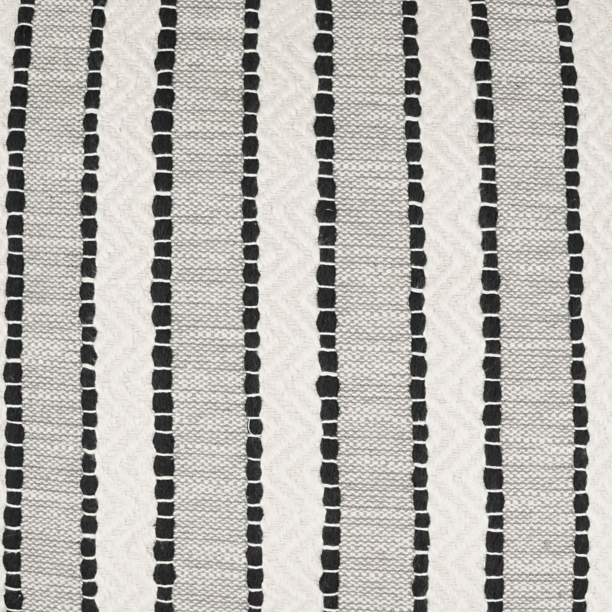 White woven fabric with narrow black vertical dotted stripes; a simple textile for decor or crafts.