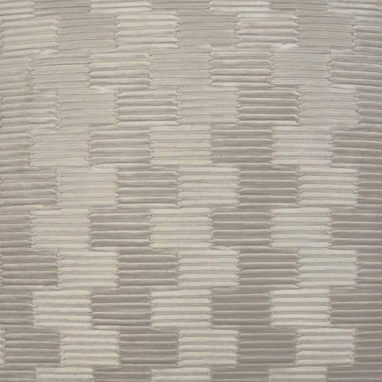 Beige-gray woven fabric with a brick-like pattern of raised rectangular bars.
