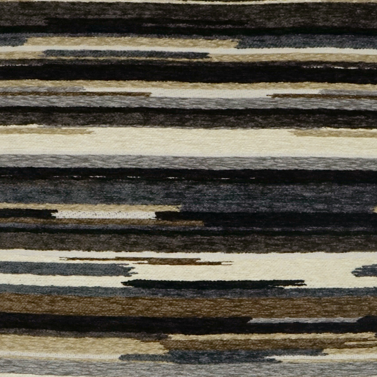 Horizontal brush-stroke striped fabric in black, brown, taupe and cream on beige; versatile rug or upholstery textile.