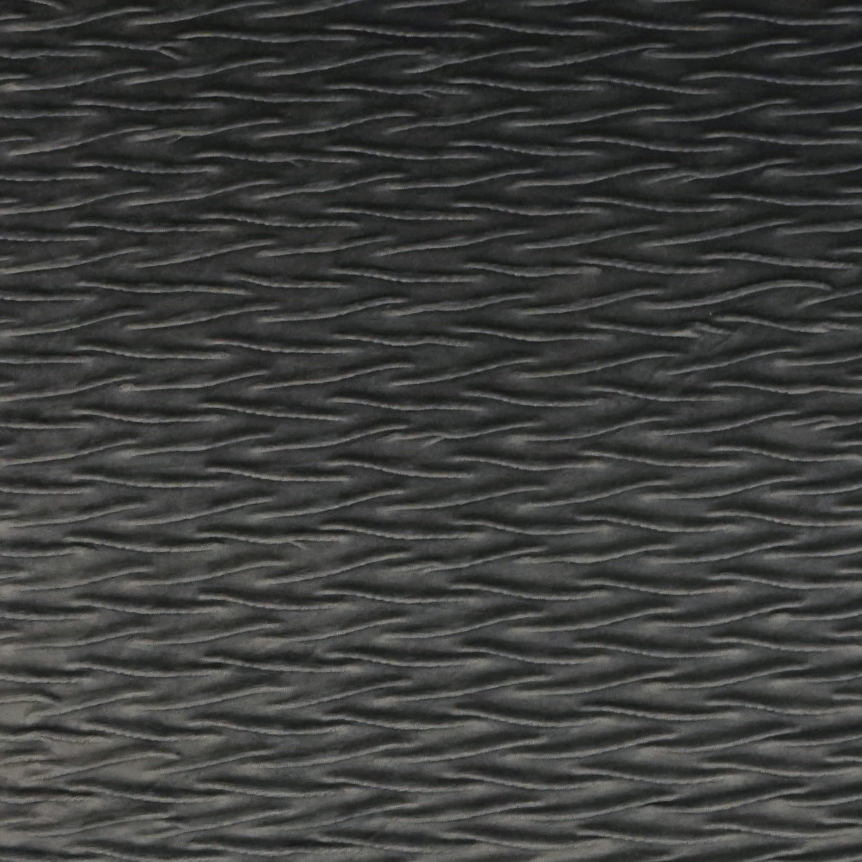 Dark gray fabric with subtle horizontal wavy ridges and a tactile texture.