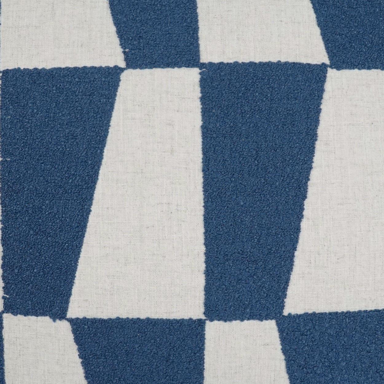 Blue and white checkerboard fabric with plush loop pile texture.