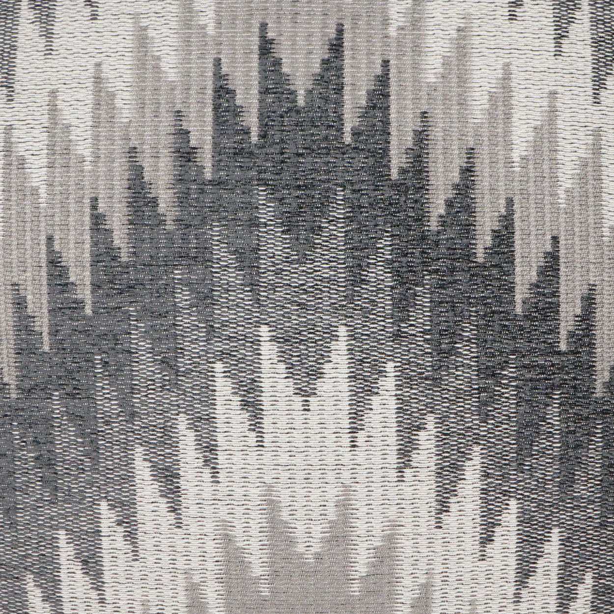 Pillow with textured woven fabric and an abstract grayscale ikat/chevron pattern in charcoal, gray and beige (24" x 24").