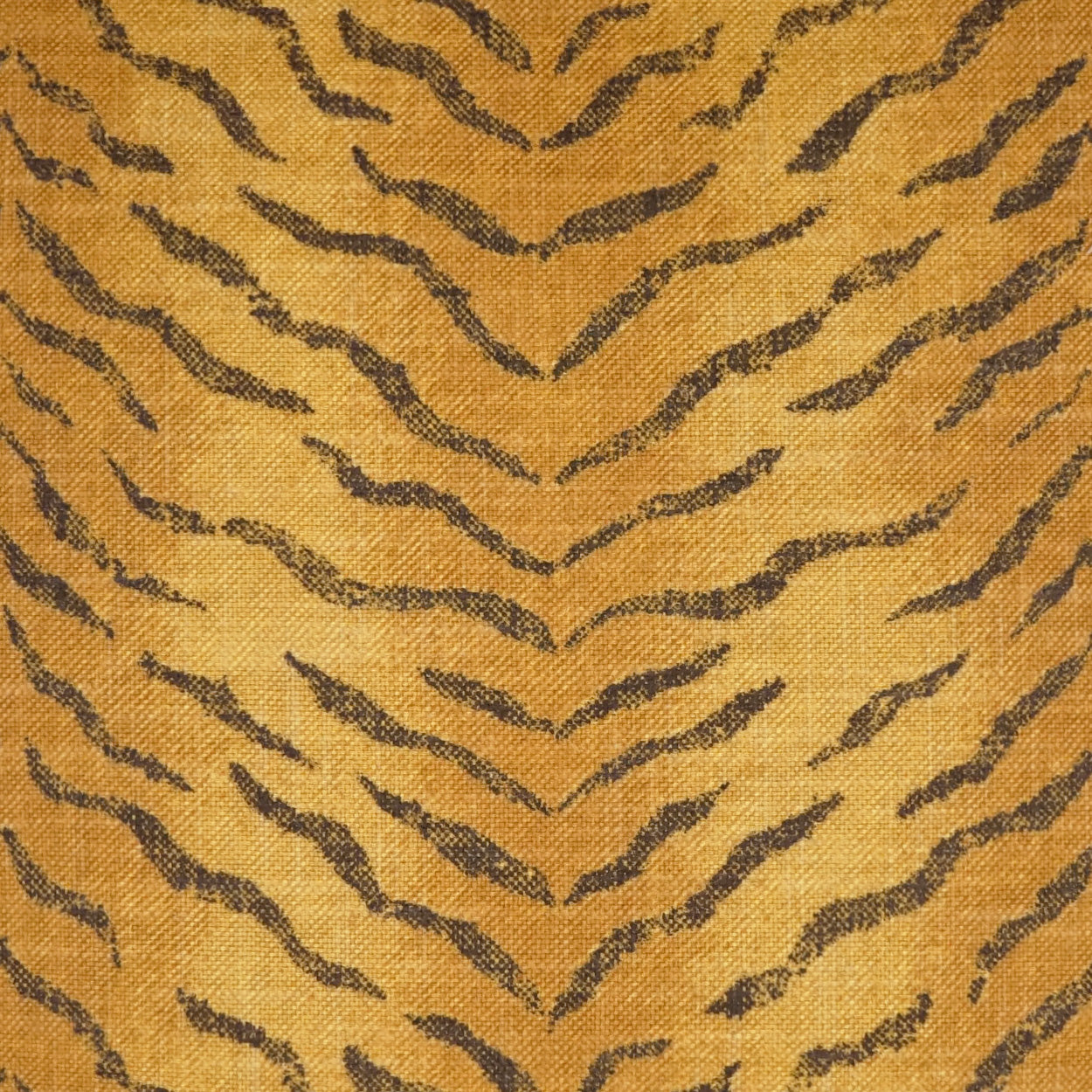 Golden yellow fabric with dark brown tiger-stripe chevron pattern; woven textile suitable for apparel or home decor.