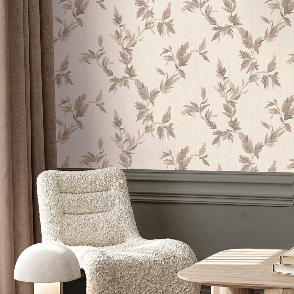 Gray wallpaper with a thin leaf gold-embossed pattern; cream boucle lounge chair with a matching rounded ottoman in a room with beige curtains.