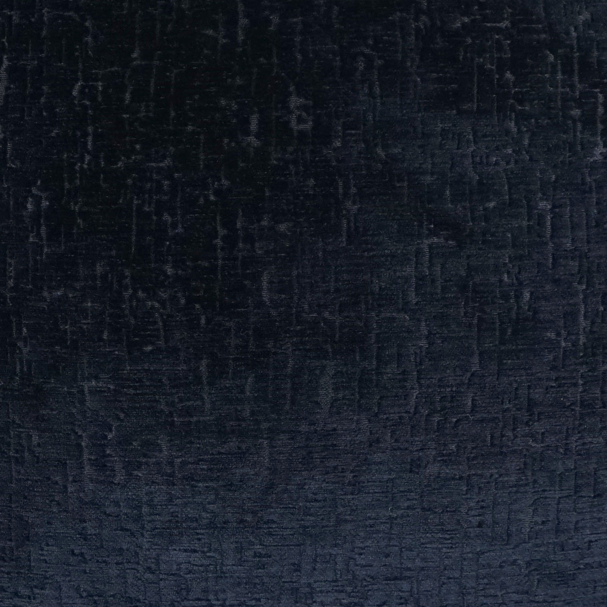 Close-up of dark navy velvet-like fabric with soft nap and subtle sheen.