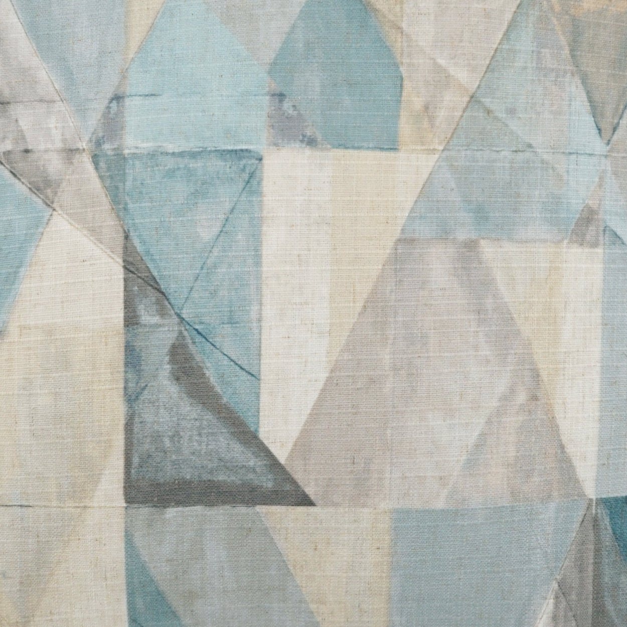 Pastel blue, gray and beige geometric triangle fabric; abstract upholstery textile.