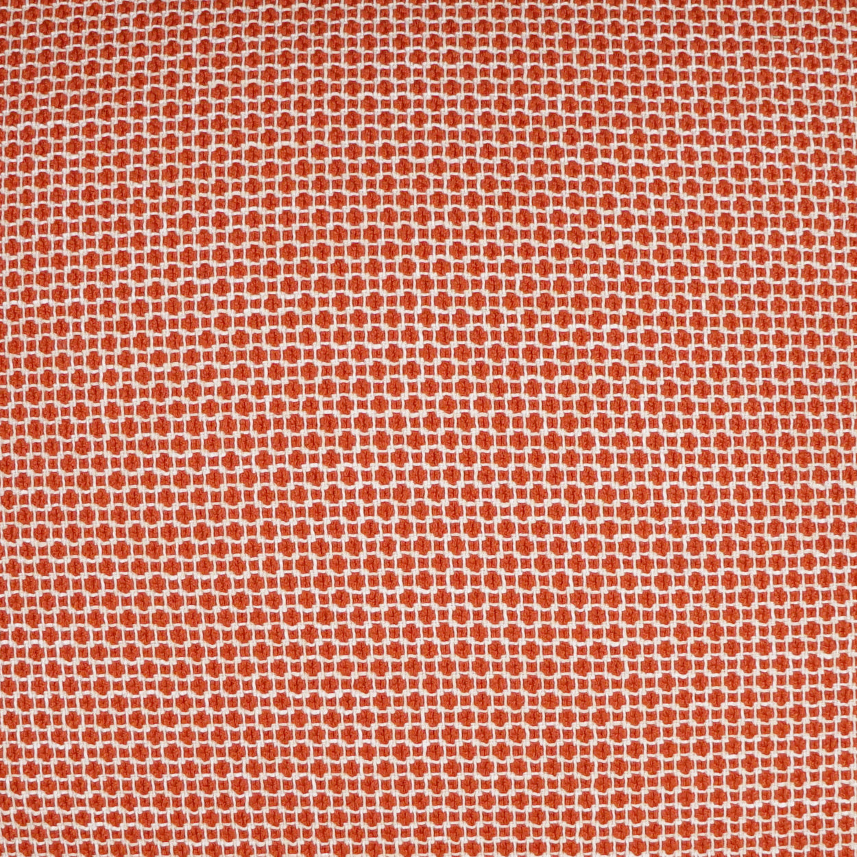 Orange fabric with tiny white dot-grid pattern; fine weave, versatile for apparel or home decor.