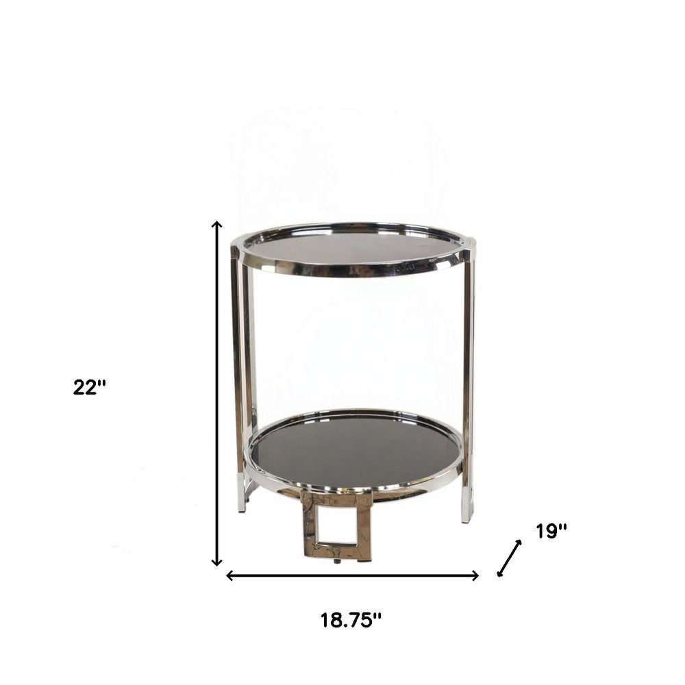 Chrome round end table with glass top and dark bottom shelf; two vertical posts, 22in tall, 18.75in dia.