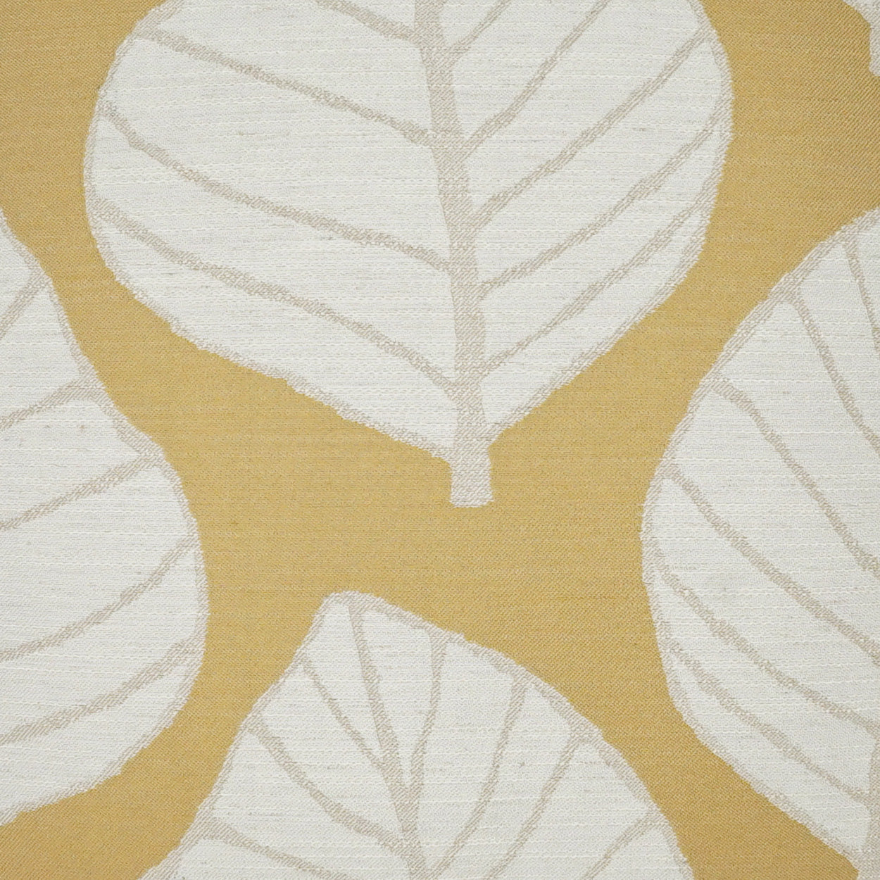Mustard yellow fabric with oversized white leaf motifs and pale gray veins.
