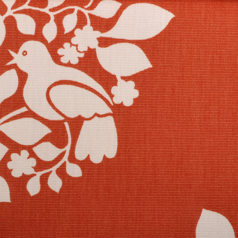 Orange woven fabric with white bird and floral vine motif; decorative textile.