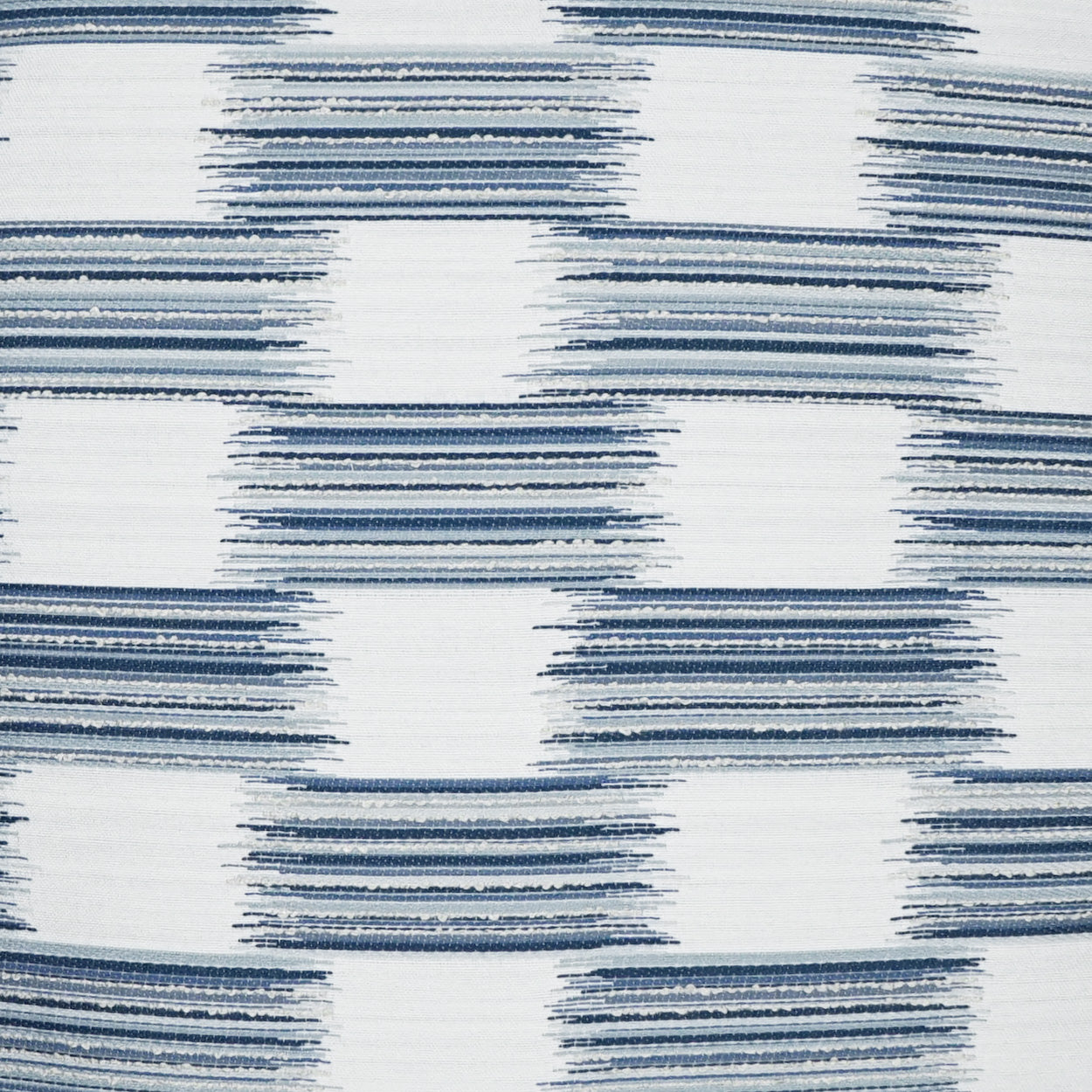 Blue brush-stroke checkered fabric pattern on white; geometric textile for upholstery or curtains.