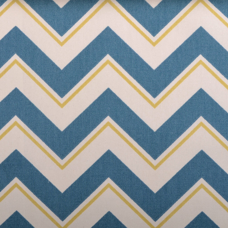 Blue chevron zigzag pattern on fabric with white chevrons outlined in thin yellow lines.