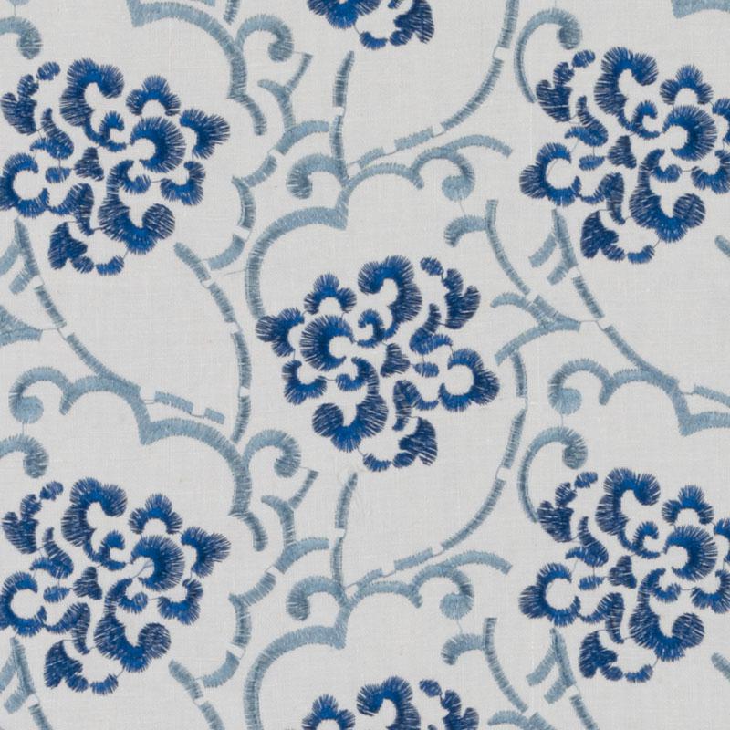 White fabric with blue floral pattern; dark navy flower clusters connected by light blue stems.