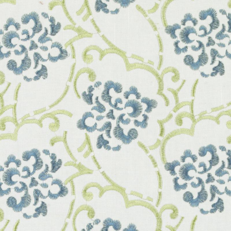 Cotton-linen upholstery fabric featuring blue floral medallions and lime-green scrolling vines on white.