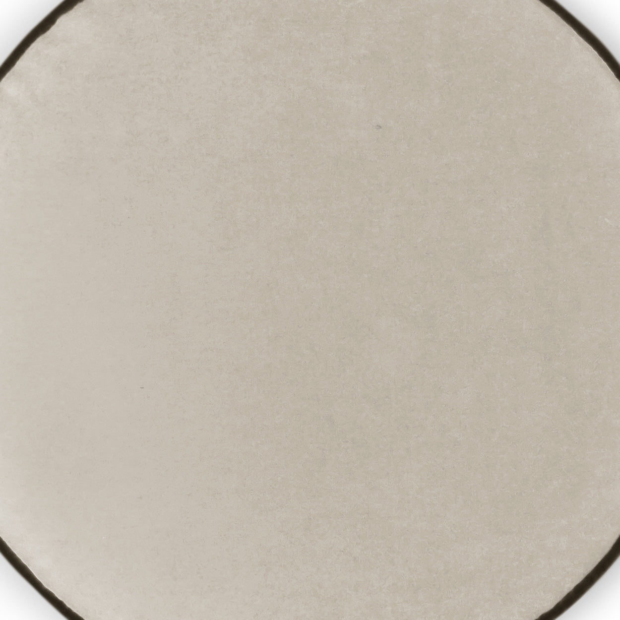 Ivory solid circular pillow with subtle texture, 18" x 18