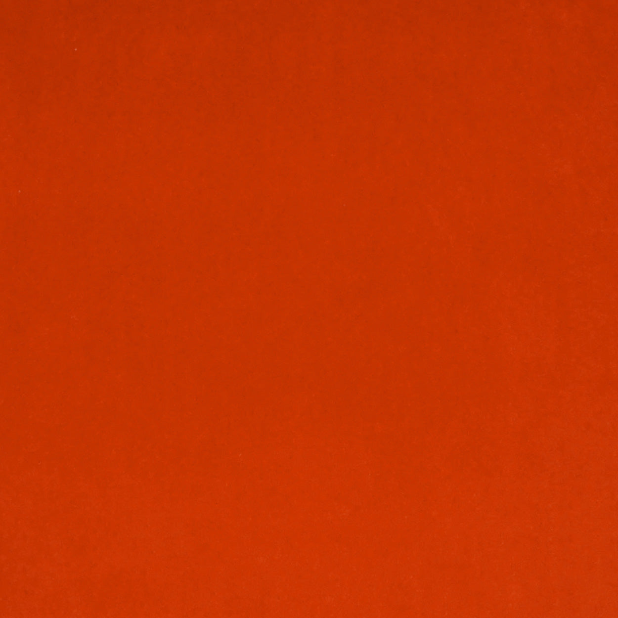 Solid bright orange pillow with a smooth, fine weave and soft texture.