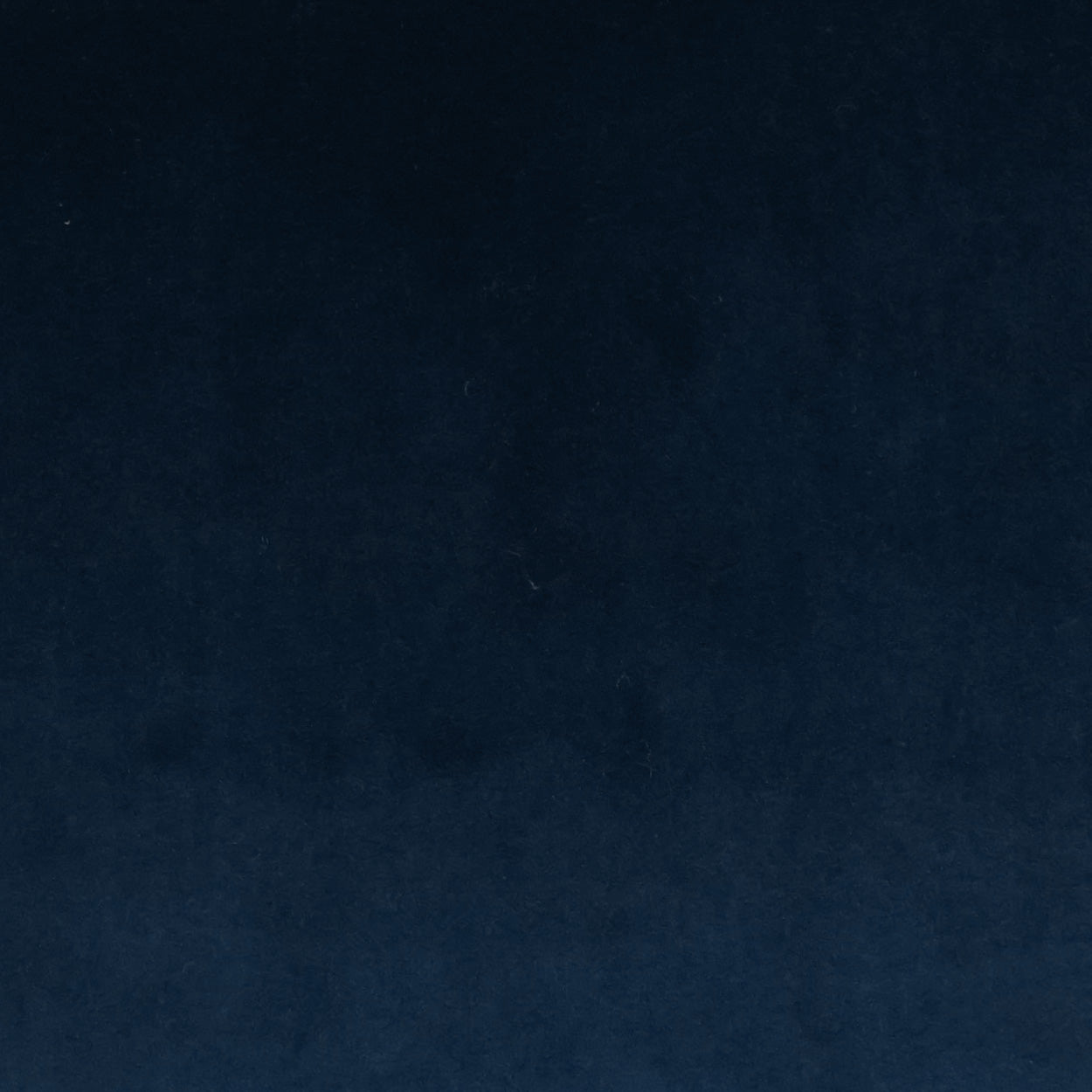 Dark navy velvet fabric close-up on a 22" x 22" pillow with a subtle gradient and soft nap.
