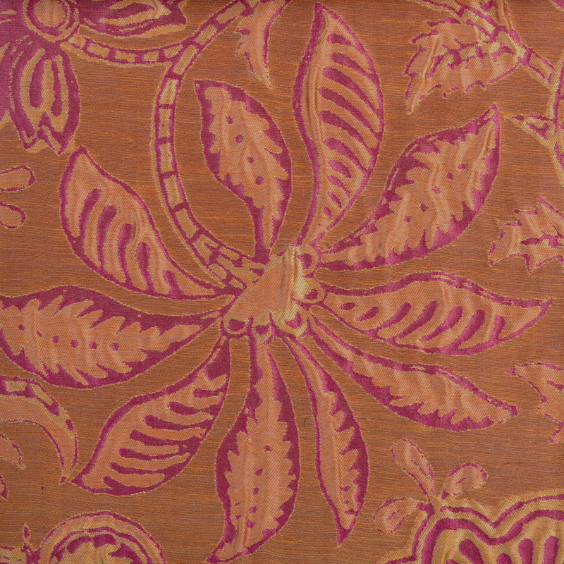Orange textile with a large magenta floral damask pattern, tapestry-style drapery fabric.
