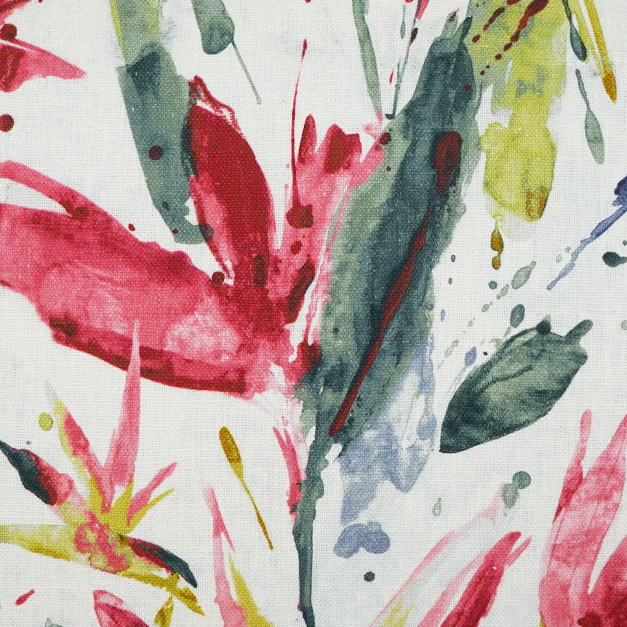 Textured fabric with abstract watercolor floral print in red, pink, yellow and green on white.