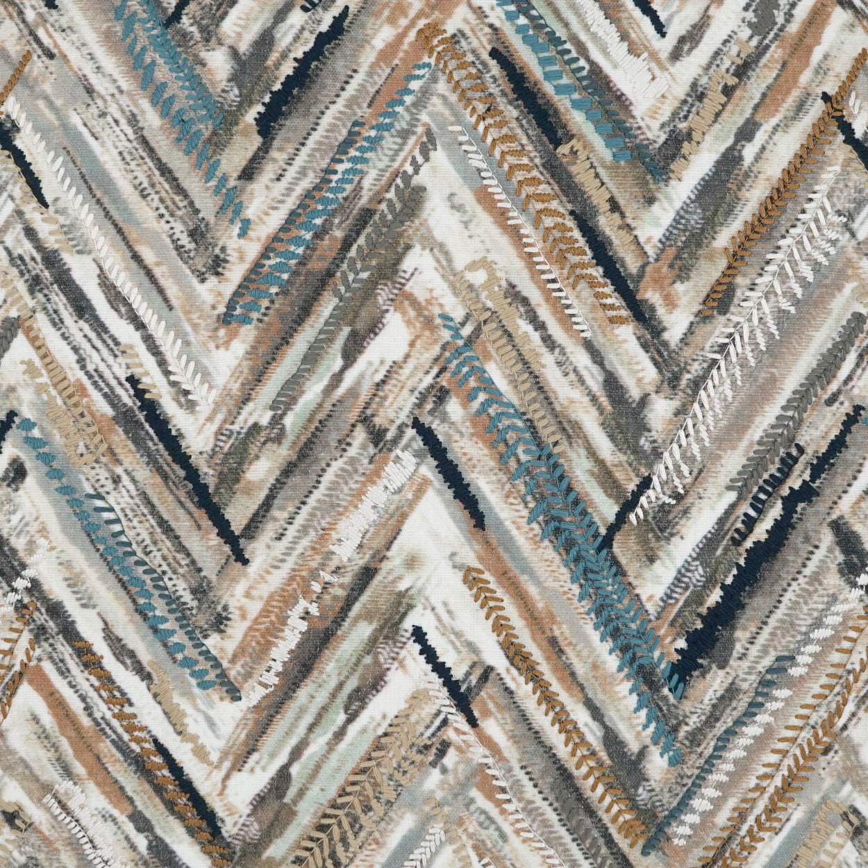 Chevron woven fabric rug in beige, tan, gray and blue with textured zigzag pattern.