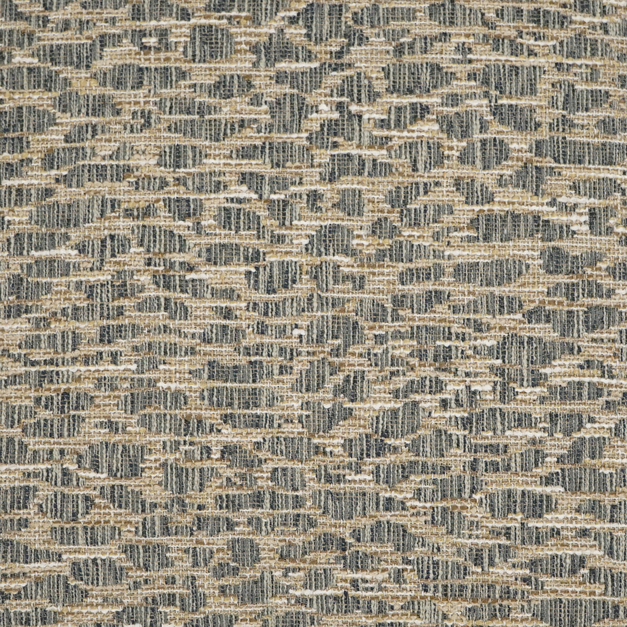 Textured woven upholstery fabric in beige and gray-blue with a repeating geometric pattern.