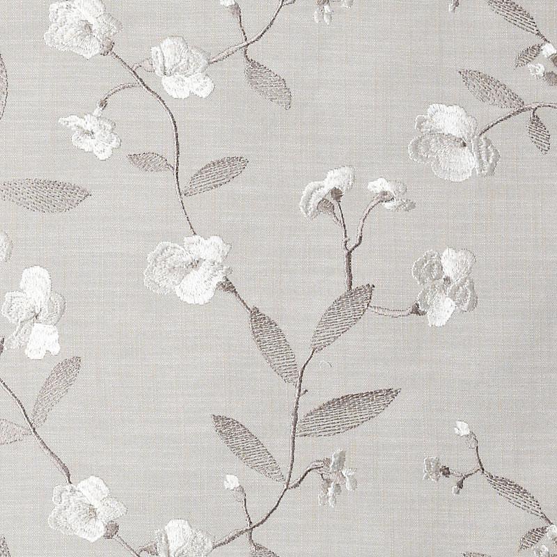 Neutral gray-beige drapery with delicate white flowers and taupe branches.