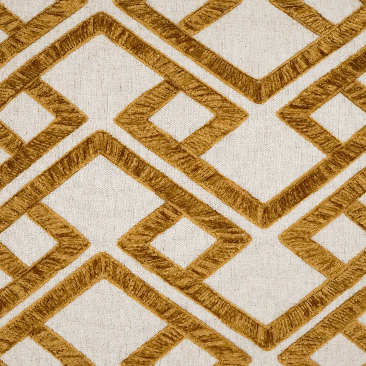 Cream fabric with gold rope-textured geometric diamond lattice pattern; decorative upholstery textile.