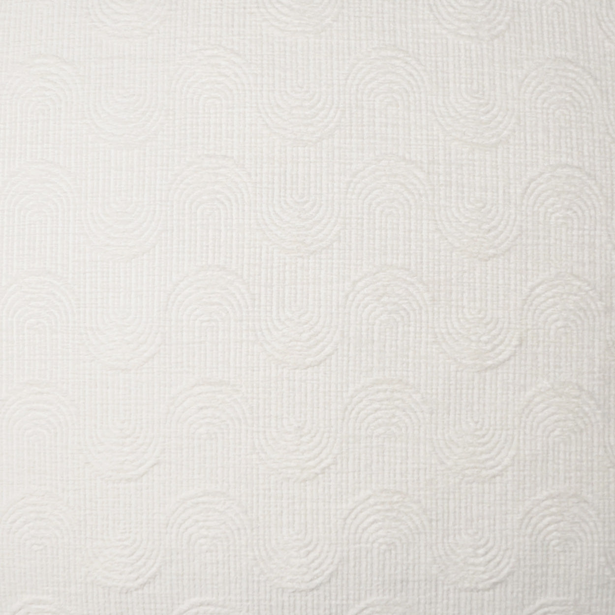 Cream fabric with a subtle embossed circular swirl pattern; fine weave, suitable for upholstery or drapery.