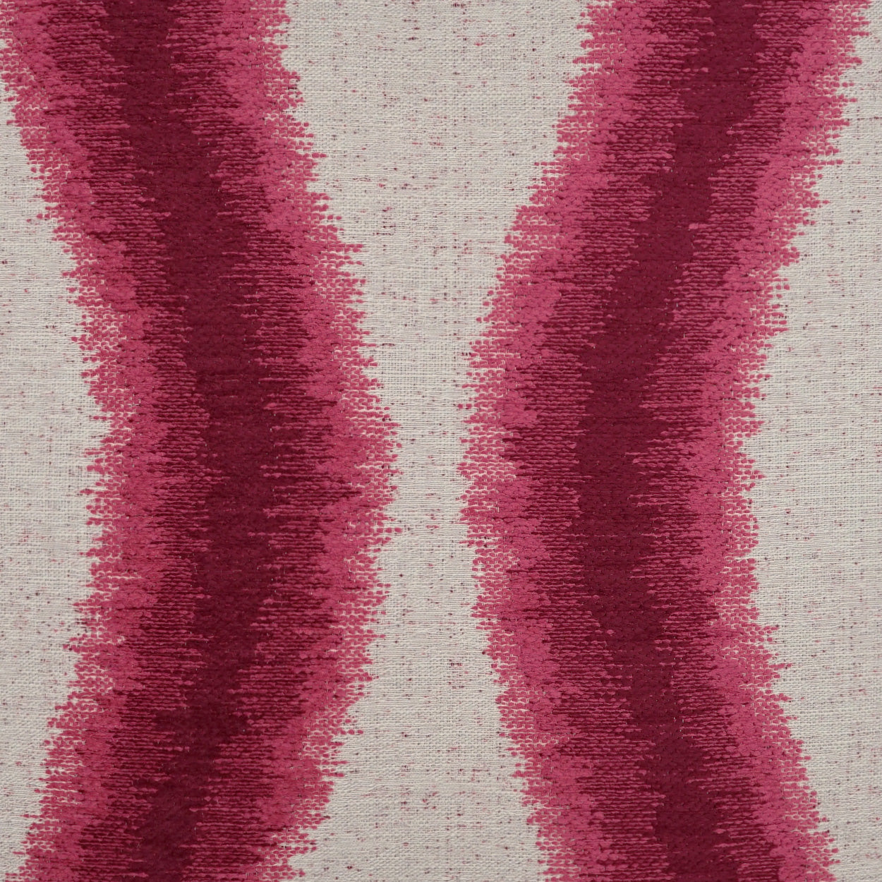 Beige woven fabric with bold magenta wavy vertical stripes; textured textile for upholstery or drapery.