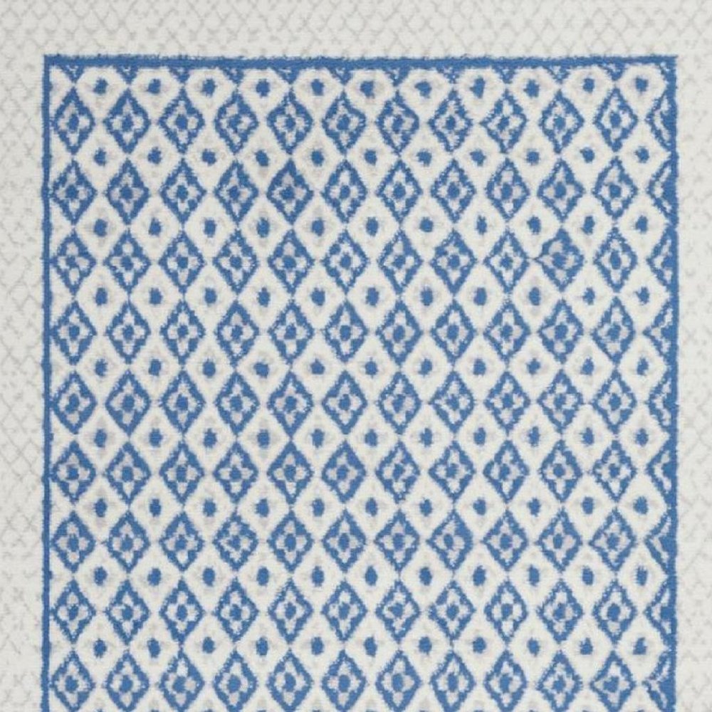 5' X 7' Ivory And Blue Geometric Area Rug