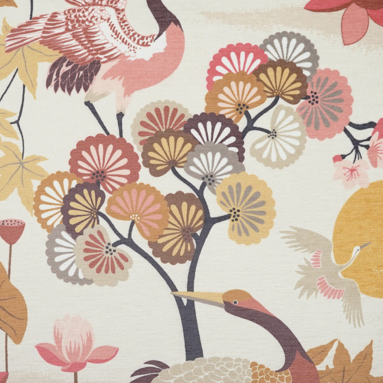 Fabric print on cream: stylized cranes among colorful chrysanthemum blossoms in pink, yellow, mauve.