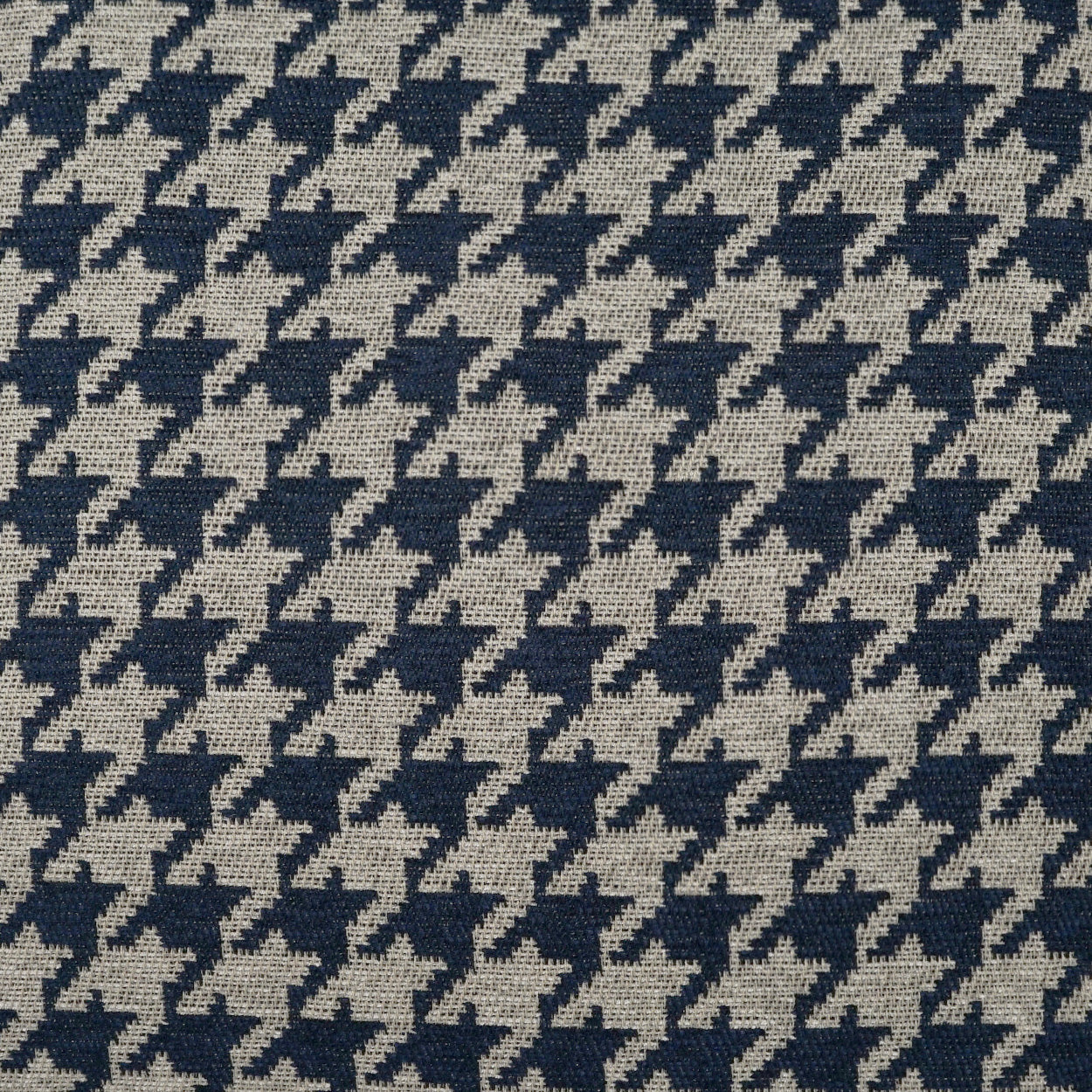 Navy & beige houndstooth woven fabric, classic textile pattern suitable for upholstery or garments.