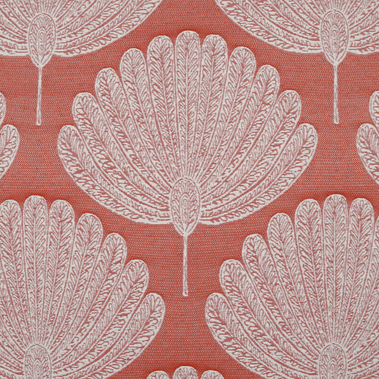 Orange fabric with white floral motifs in a repeating pattern.