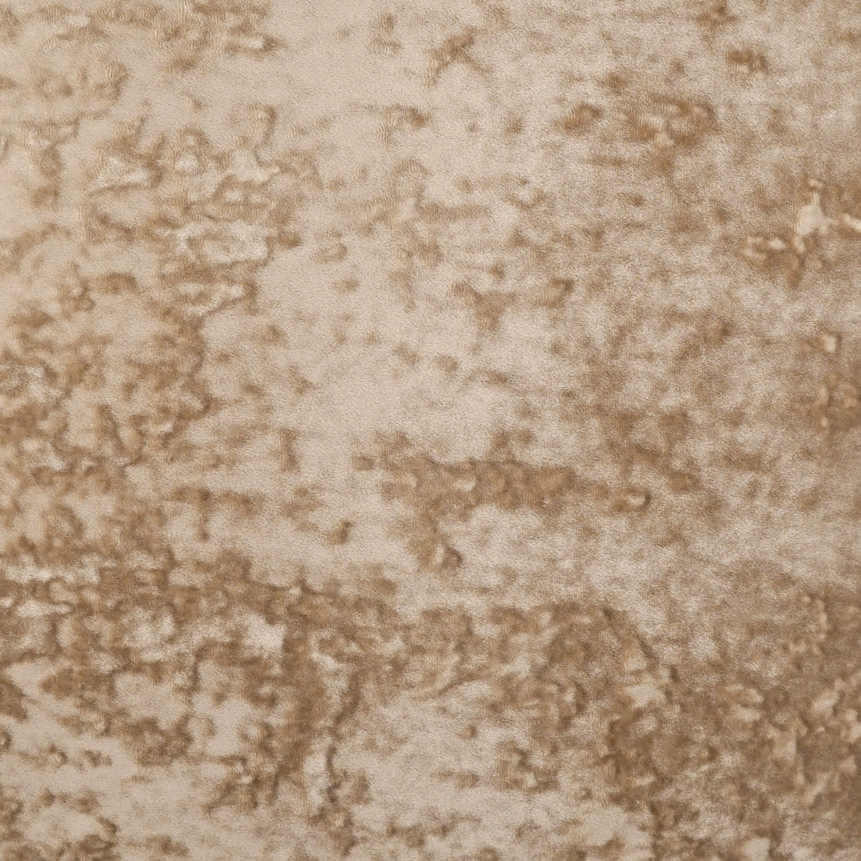 Beige mottled fabric texture with tan-brown speckles, suede-like upholstery material.