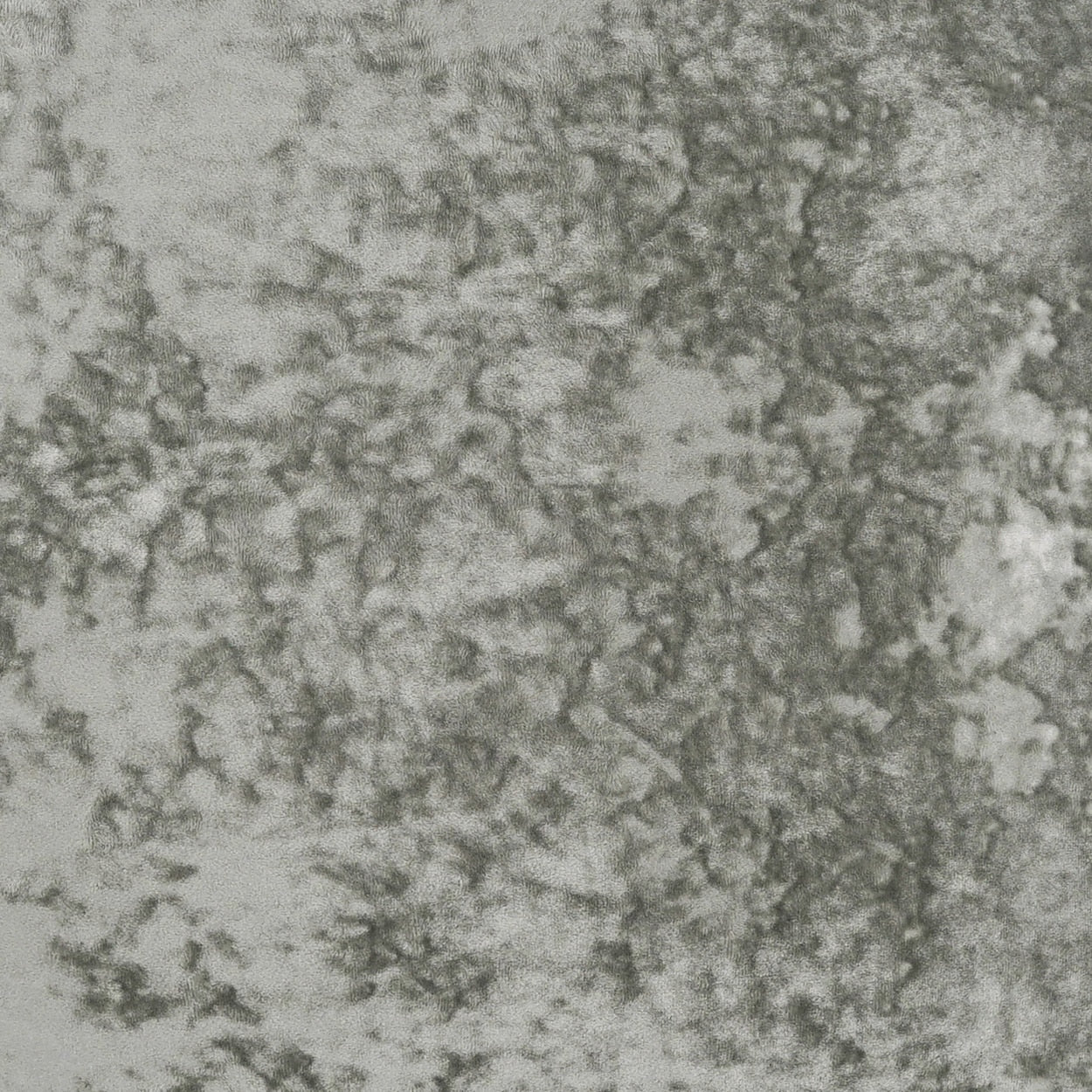 Grey mottled fabric texture with irregular lighter and darker blotches, upholstery-style.