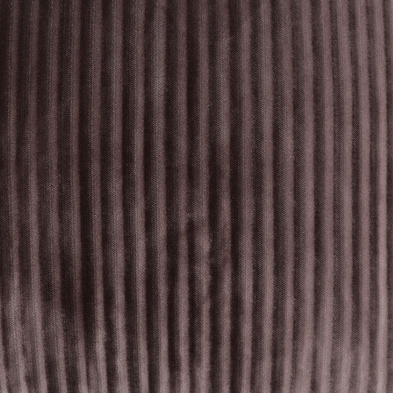 Brown corduroy fabric with vertical ridges (wales) and soft textured weave.