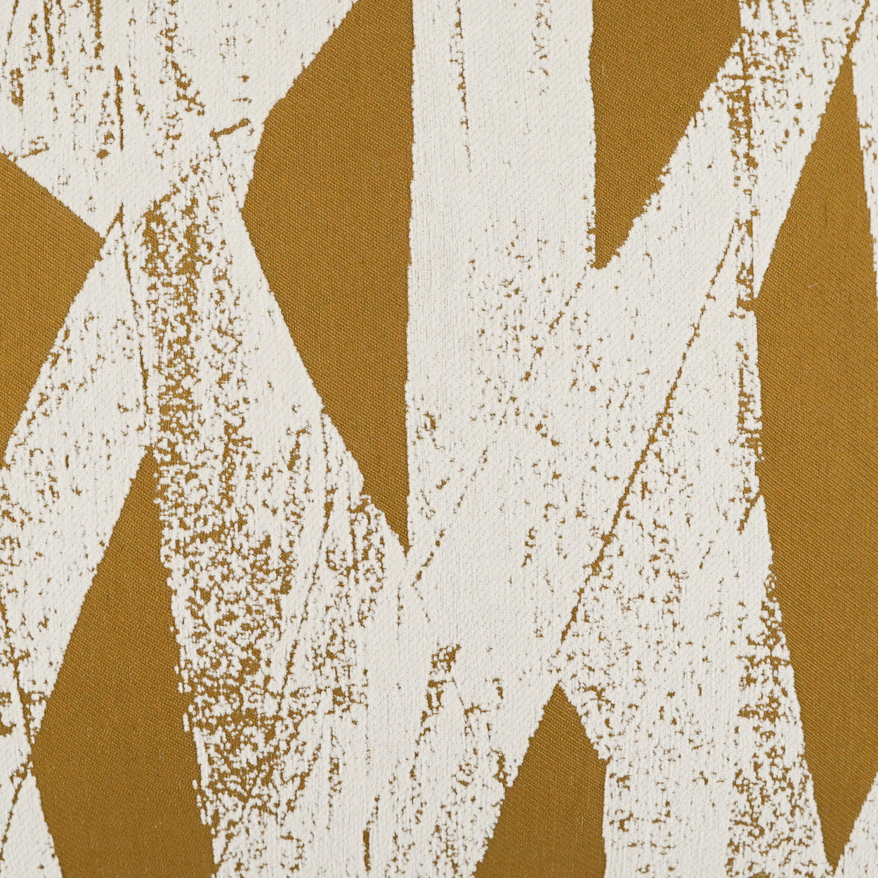Mustard-yellow fabric featuring large irregular white brush-stroke pattern.