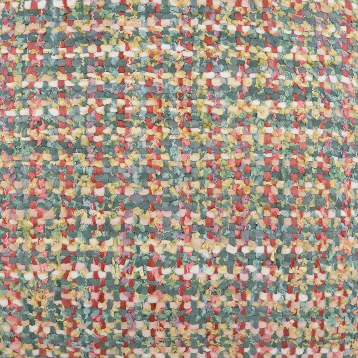 Textured multicolor woven tweed fabric swatch with tiny square flecks in red, yellow, teal, blue and white.