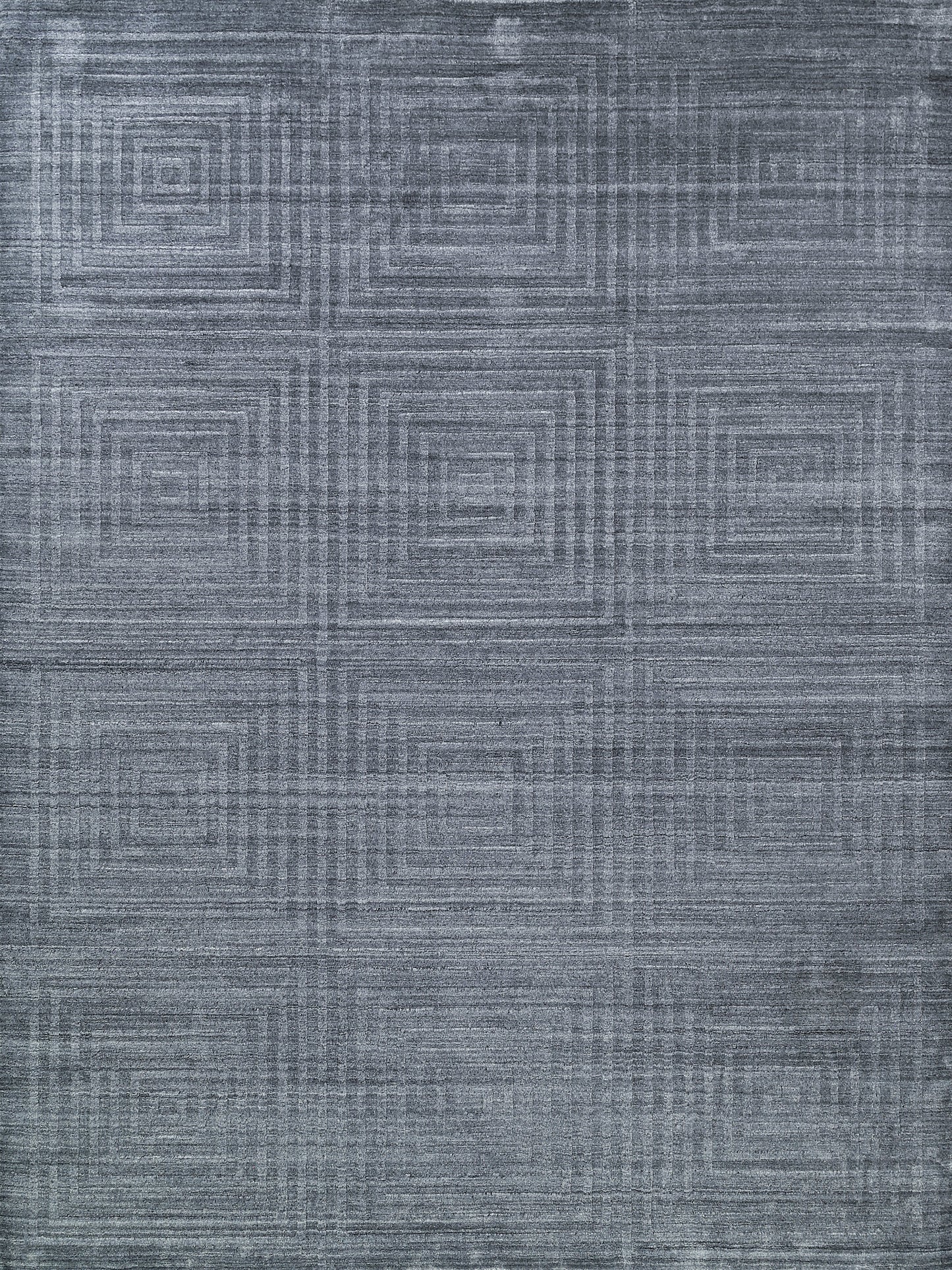 Textured gray area rug featuring a geometric square pattern in varying shades, suitable for modern decor styles.